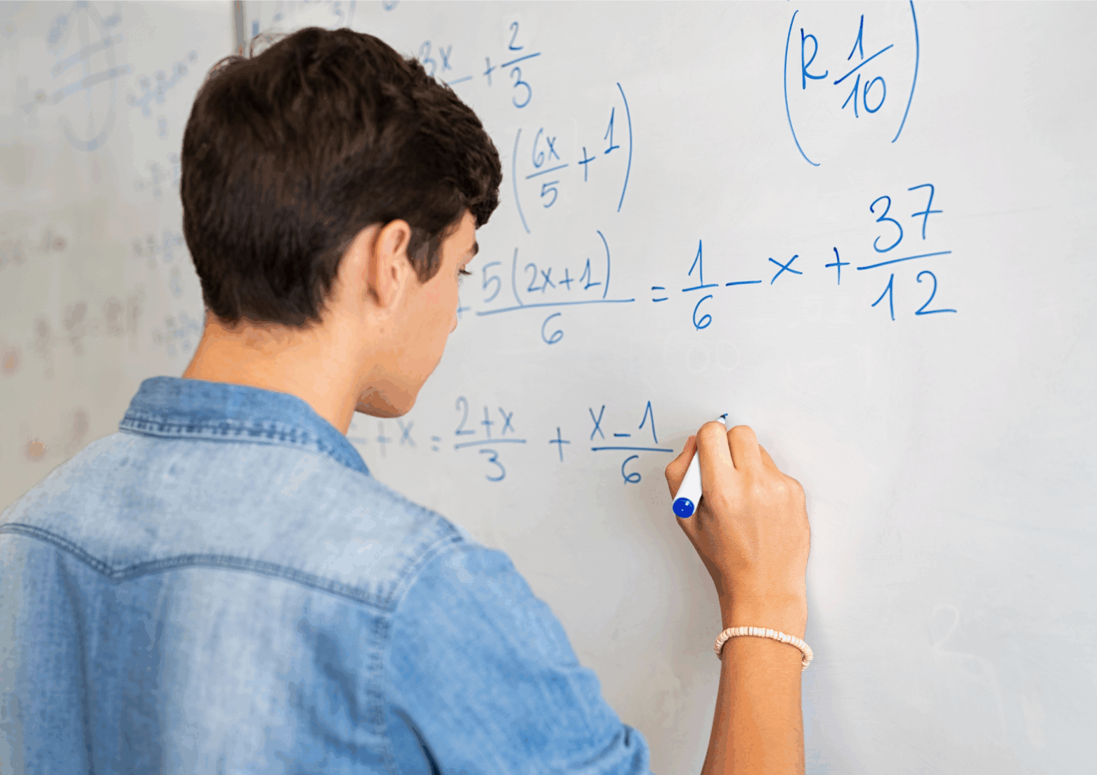 ATAR mathematics applications student doing a sum on a whiteboard