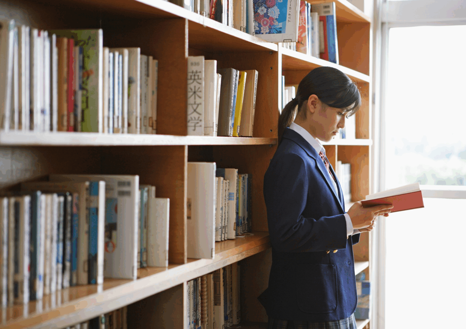student studying ATAR literature in a library